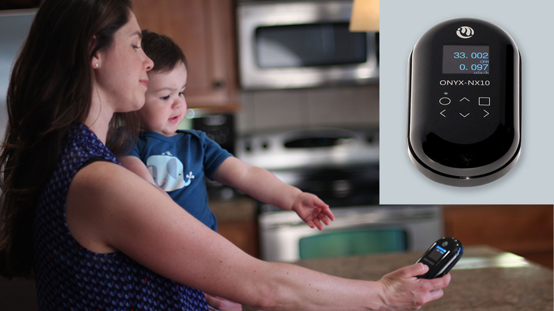 A mother with baby measures ambient radiation levels in their home using a Medcom ONYX® Geiger counter.